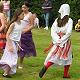 children folk dancing in vlaski costume at a fete